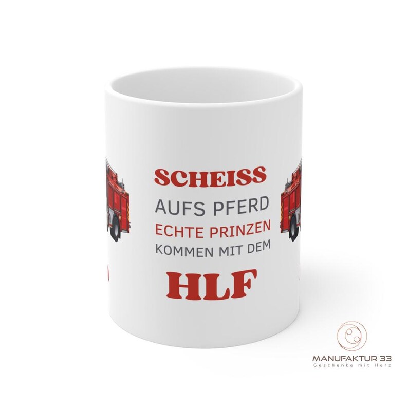 May include: White ceramic mug with the text "SCHEISS AUFS PFERD ECHTE PRINZEN KOMMEN MIT DEM HLF" in red. The mug features a red fire truck graphic on each side. The bottom right corner has a logo.