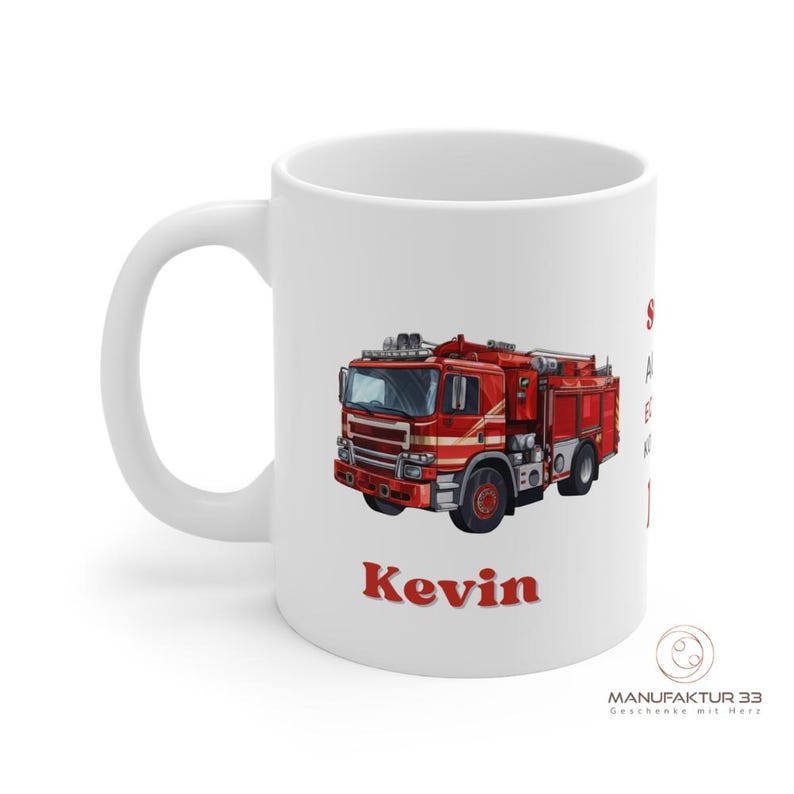 May include: White ceramic mug featuring a red fire truck illustration. The mug has the name "Kevin" in red lettering. The mug also has text in German. The mug has a white handle and a logo on the bottom right.