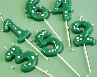 Vela de cumpleaños con forma de dinosaurio verde (números del 0 al 9)
