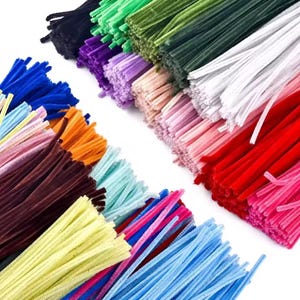 May include: A selection of brightly coloured pipe cleaners, including shades of blue, orange, red, green, and purple. These craft supplies are arranged in bundles, showing their soft, fuzzy texture. Perfect for arts and crafts projects.