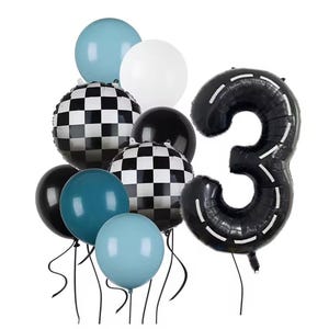 May include: A selection of party balloons in different colours and shapes. Features a large black number three balloon with a road design, checkerboard balloons, and solid-coloured balloons in blue, black, and white. Ideal for a birthday party.