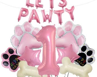 Globos de cumpleaños con forma de pata de perro: globos rosas con números, huellas y huesos.