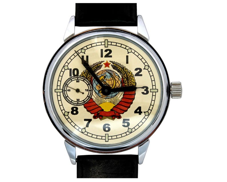 Soviet Molnija Watch. The white dial beautifully displays the USSR Coat of Arms with a five-pointed red star on top