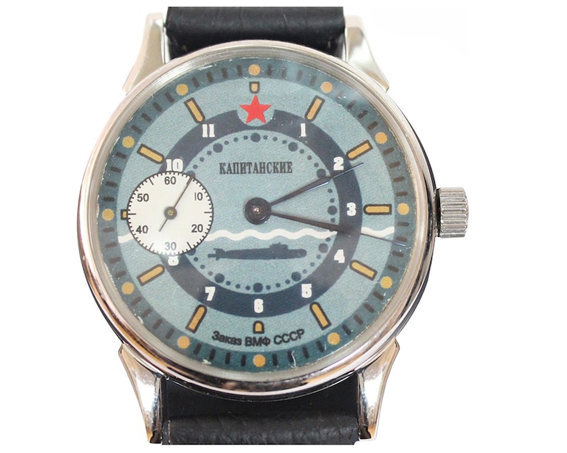 Molnija wristwatch. The blue dial is made in a marine style, the numbers are placed in a circle in the form of a steering wheel.