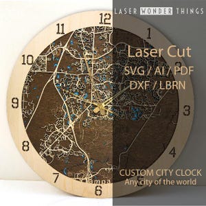 May include: A wooden clock with a laser-cut design of a city map. The clock face is surrounded by a light wood frame with numbers 1 through 12. The text "Laser Cut SVG / AI / PDF DXF / LBRN CUSTOM CITY CLOCK Any city of the world" is printed on the clock face.