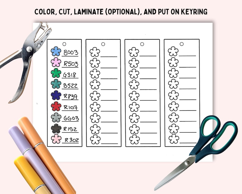 May include: A printable sheet with the text COLOR, CUT, LAMINATE (OPTIONAL), AND PUT ON KEYRING. It features four columns of flower-shaped outlines with lines for writing, plus a color reference chart with codes like B003 and R503. Includes a hole punch and scissors.