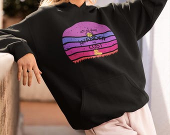 May include: Black hoodie with a retro sunset graphic and the text "Not all who wander are lost".