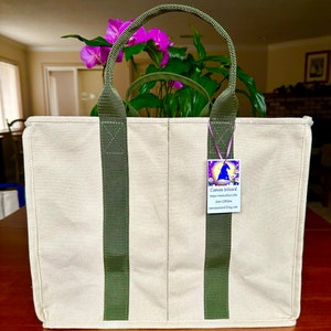 May include: A natural canvas tote bag with avocado straps.