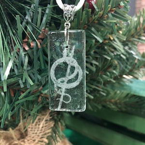 Rod of Asclepius on glass pendant with cord
