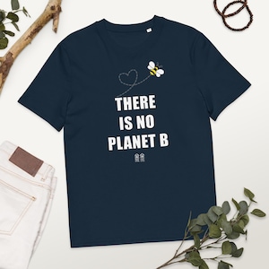 May include: A navy blue t-shirt with a white graphic of a bee flying with a heart made of dotted lines. The text "THERE IS NO PLANET B" is printed in white below the bee.