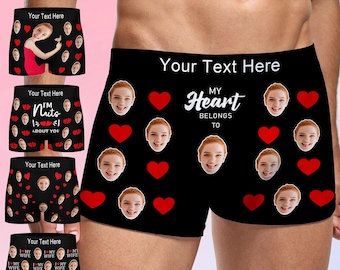 May include: Black boxer shorts with custom text and a repeating pattern of faces and red hearts. The text "My Heart Belongs To" is displayed on the front. Additional pairs feature various designs and text, including "I'm Nuts About You."