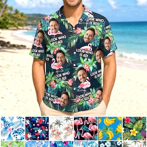 May include: A short-sleeve button-down shirt with a dark tropical print featuring green palm leaves, pink hibiscus flowers, and pink flamingos. The shirt is customized with a repeating pattern of a man's face and the text Look Who Is 60!