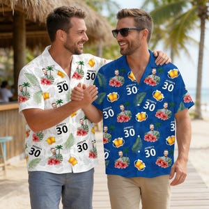 May include: Two short-sleeved button-down shirts with a tropical theme. One is white, the other is blue. Both shirts feature a repeating pattern of a person's image, the number "30", beer mugs, and tropical flowers.