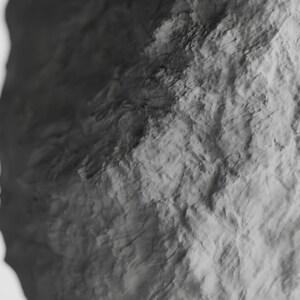 May include: A close-up of a textured, gray rock surface. The surface is rough and uneven, with a variety of shades of gray.