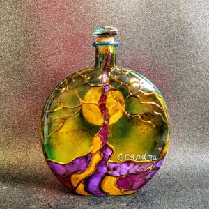 tree of life urn
colors--purple, pink and yellow
hummingbird cork top