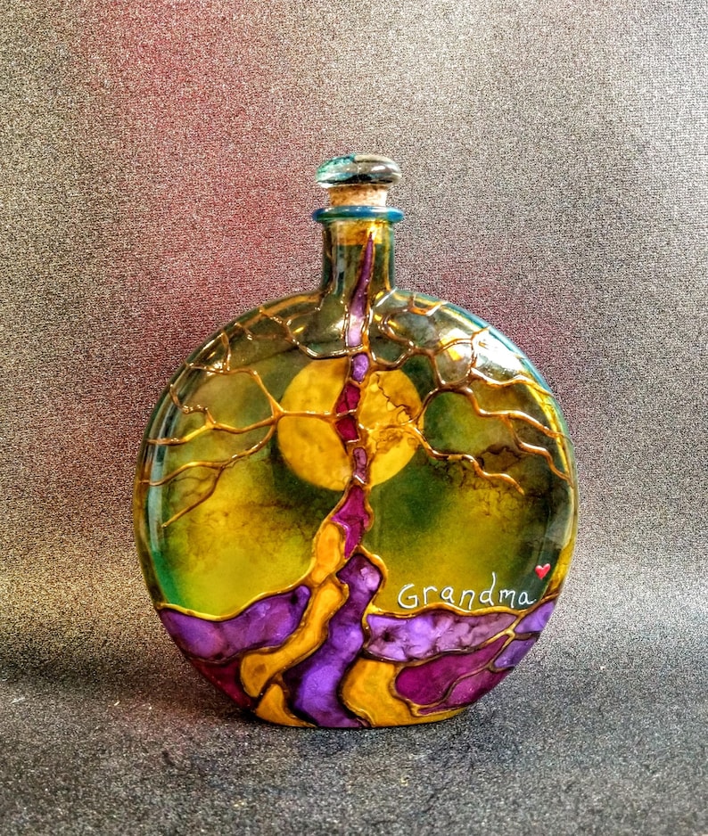 tree of life urn
colors--purple, pink and yellow
hummingbird cork top