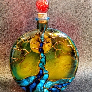 tree of life urn
colors-- light and dark blue
red heart cork top