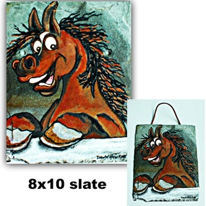 May include: A hand-painted slate wall hanging featuring a cartoon horse with a playful expression. The horse is brown with black and orange accents. The slate is 8x10 inches and has a rustic, textured surface.