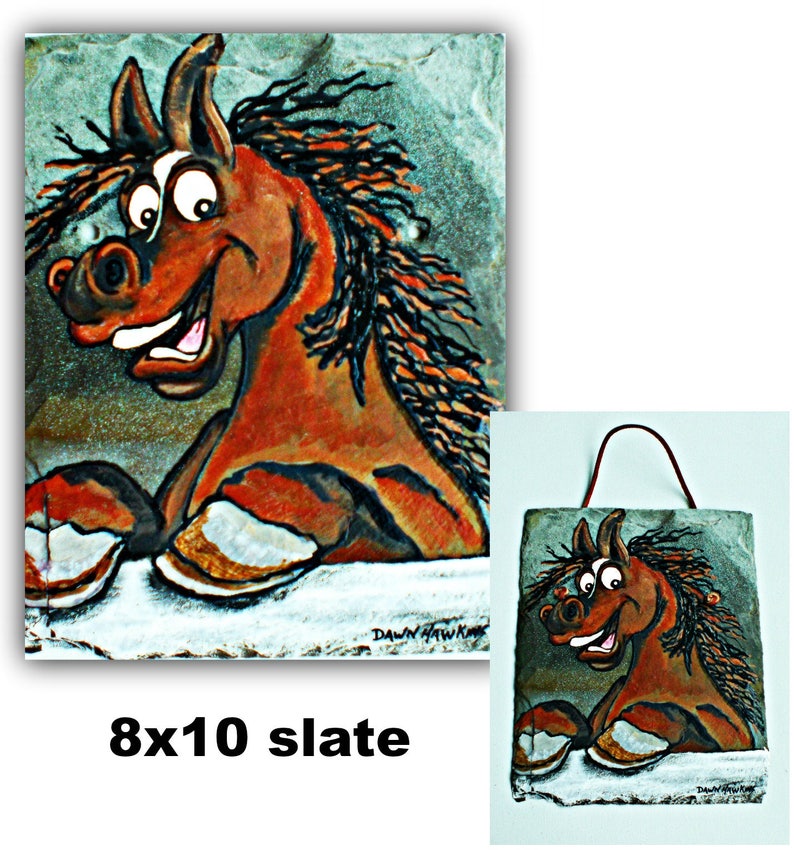 May include: A hand-painted slate wall hanging featuring a cartoon horse with a playful expression. The horse is brown with black and orange accents. The slate is 8x10 inches and has a rustic, textured surface.