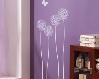 May include: A purple wall with a white dandelion flower stencil design. The stencil features four dandelion flowers with long stems and white butterfly silhouettes.