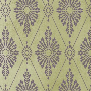May include: A seamless pattern with a repeating design of purple stylized flowers on a light green background.
