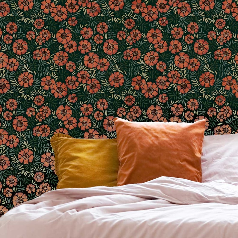 May include: A bed with a floral patterned headboard, two pillows, and a white duvet. The floral pattern is orange and green on a dark background.