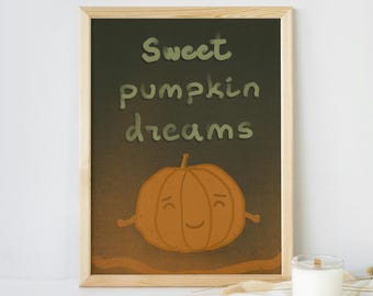 Op de afbeelding: Een ingelijst schoolbord met een groene achtergrond en de tekst "Sweet pumpkin dreams" in wit. Onderaan het schoolbord staat een cartoon-pompoen met een glimlach.