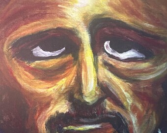 May include: A painting of a man's face with a dark brown mustache and a light brown beard. The man has a serious expression and his eyes are closed. The painting is done in a realistic style and the colors are muted.