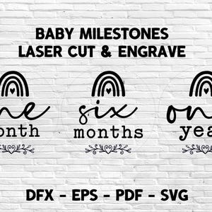 May include: Black and white baby milestone signs with rainbow and heart designs. The signs read "one month", "six months", and "one year". The text "BABY MILESTONES LASER CUT & ENGRAVE" is at the top. The bottom of the image has file type options.