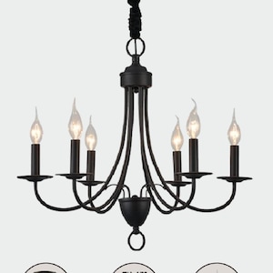 May include: Black metal chandelier with six candle-style light bulbs. The chandelier has a traditional design with curved arms and a central base.