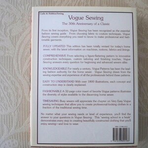 May include: A book titled "Vogue Sewing" celebrating its 30th anniversary. The cover features text describing the book's content, including fashion techniques, updated information, and illustrations. It's a guide for sewers of all levels.