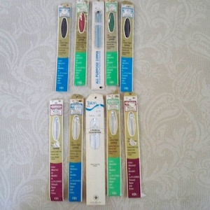 May include: A collection of 11 zipper packages, all in various colors and lengths. The packages are labeled with the brand name "Talon" and "YKK", and some feature the text "Lifetime Guarantee".