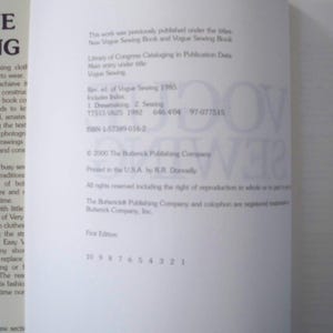 May include: Open book page with text about sewing. The text includes the title "Vogue Sewing" and copyright information. The page is white with black text and a large "VOGUE SEWING" watermark.