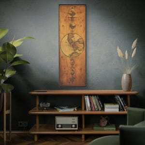 May include: A vertical wooden wall art piece with a vintage map design. The artwork features a detailed world map in the center, surrounded by celestial and decorative elements. The piece is framed in black and has a warm, natural wood tone.