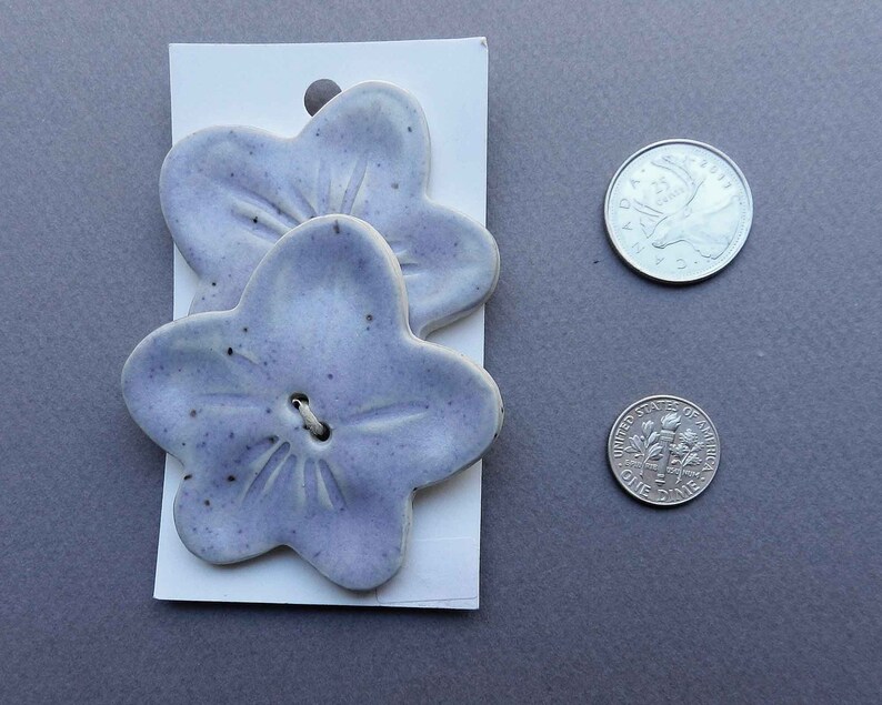Large Pair of Lavender Flower Shaped Buttons