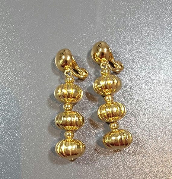 gold tone earrings clip on style dangle drops