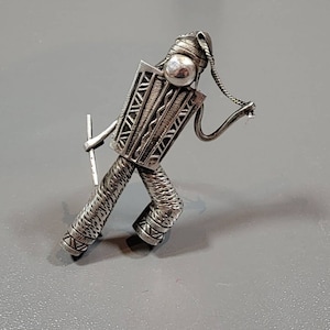 sterling silver brooch figural peru man with flute peru andes peruvian
