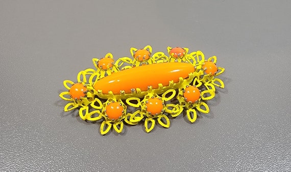 orange and yellow brooch Austrian flower
