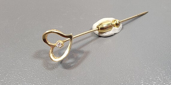 lapel pin heart 14 karat yellow gold with a tiny diamond accent vintage estate brooch