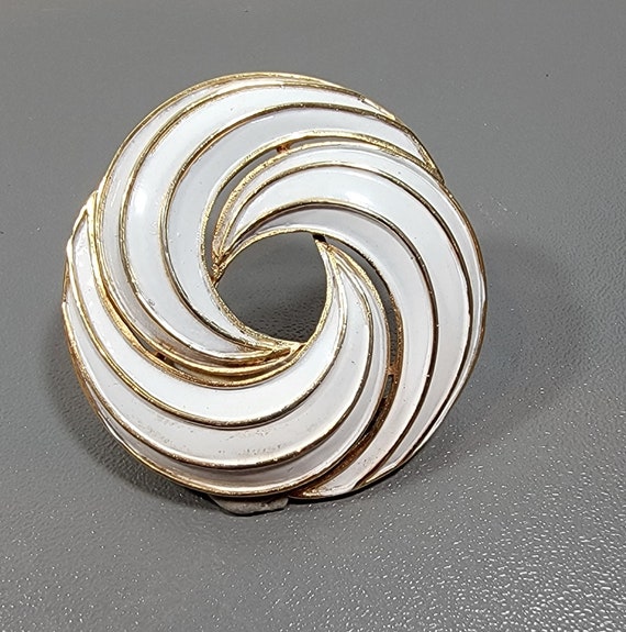 trifari brooch white enamel swirling circle