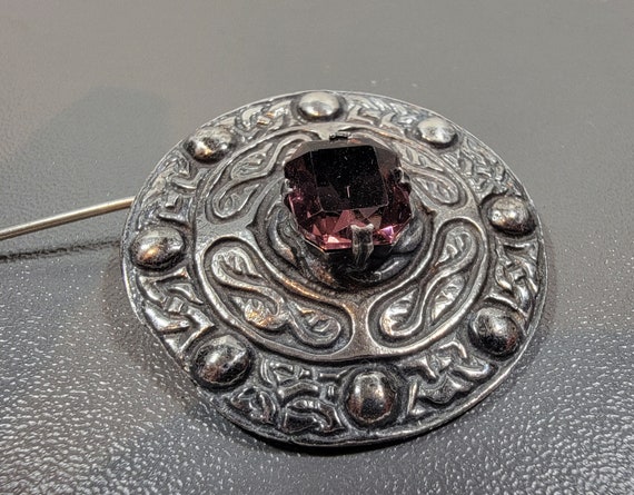 purple celtic brooch shield shaped glass stone