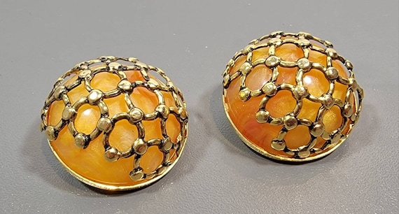 bakelite earrings swirly butterscotch cabochons in golden cages clip on