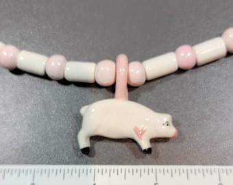 piglet necklace pottery beads handmade whimsical pale pastel colors