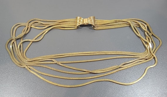chain necklace bow clasp six strands of fancy chain