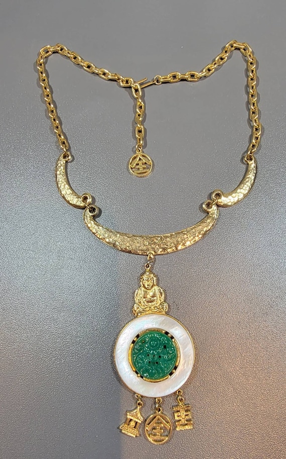 Buddha necklace gold tone green glass rhinestone and mother of pearl