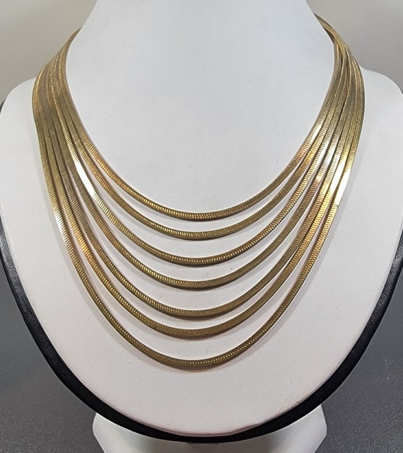 chain necklace bow clasp six strands of fancy chain
