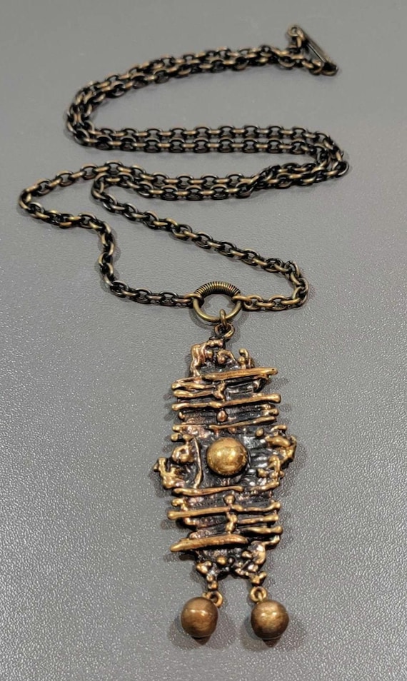 Bronze pendant necklace sarpaneva long chain organic inspired shape