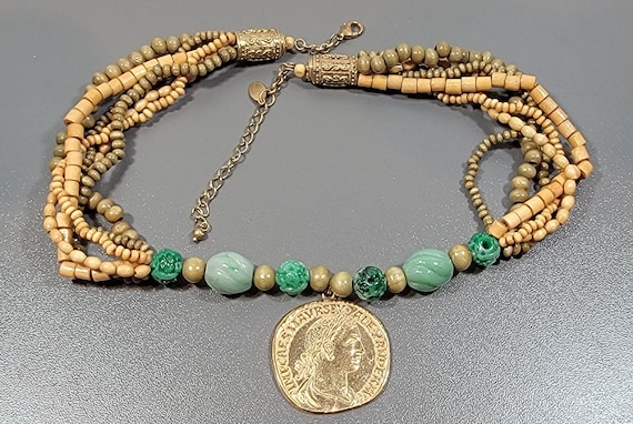 coin pendant necklace multi strands of beads green and gold