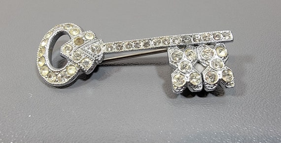 key brooch rhinestones rhodium plated base metal