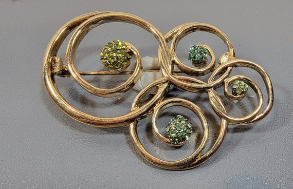 green rhinestone brooch large gold tone swirly pave